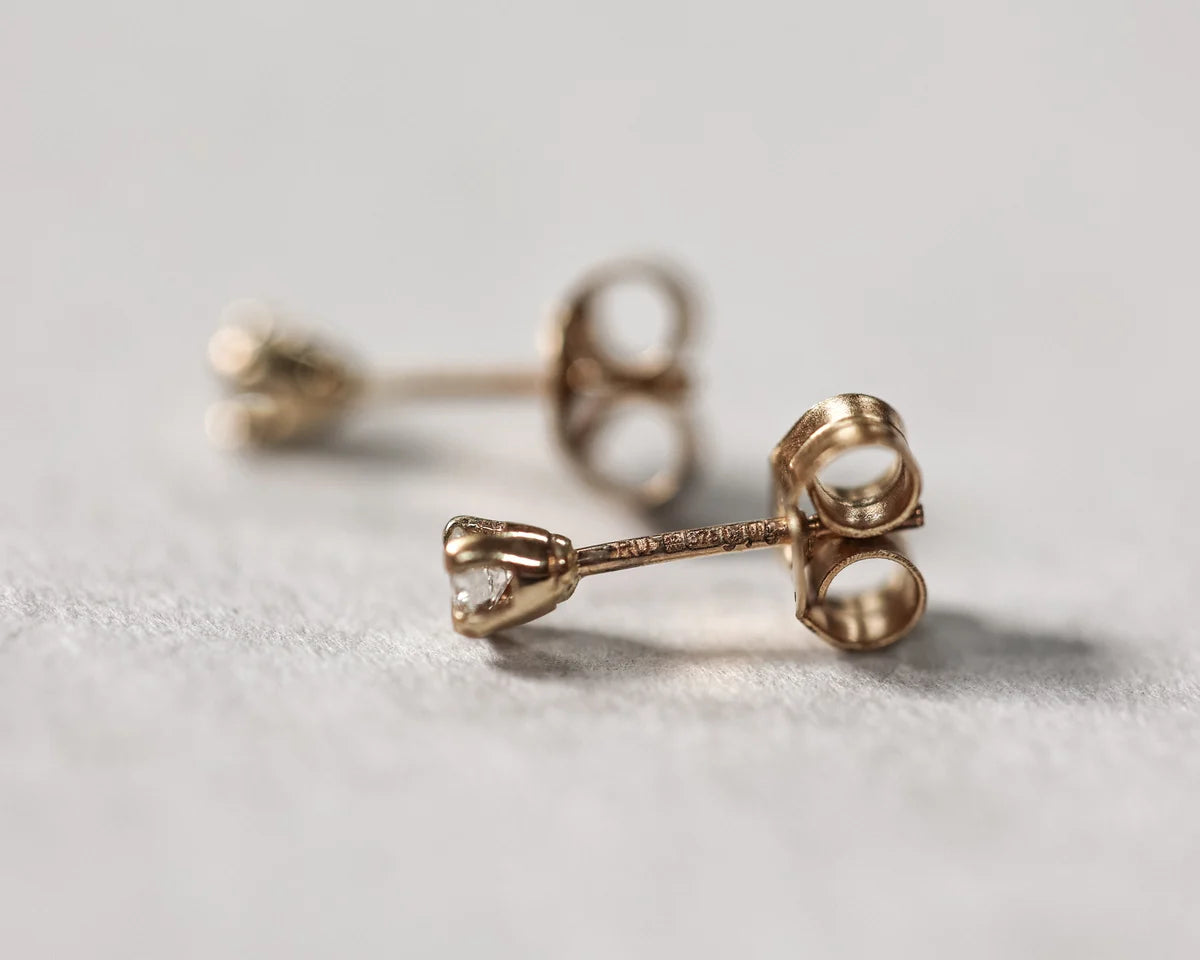 butterfly back gold diamond stud earrings detail