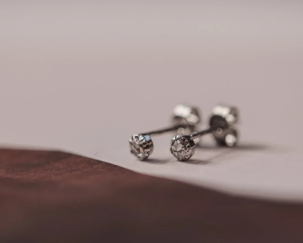 close up rose cut diamond 3mm stud earrings platinum detail