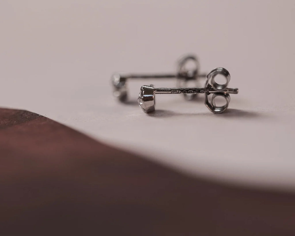 butterfly back detail platinum diamond stud earrings