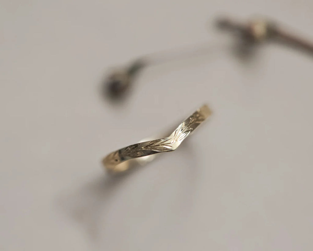 Side view of 18ct yellow gold olive leaf engraved wishbone ring