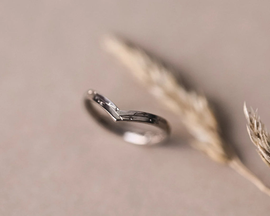Angled view of 2mm pressed flower wishbone ring in white gold