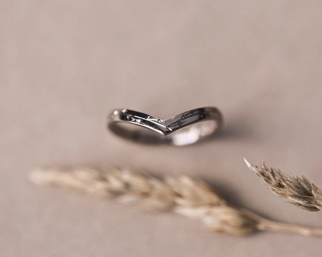 Front view of 18ct white gold pressed flower wishbone ring