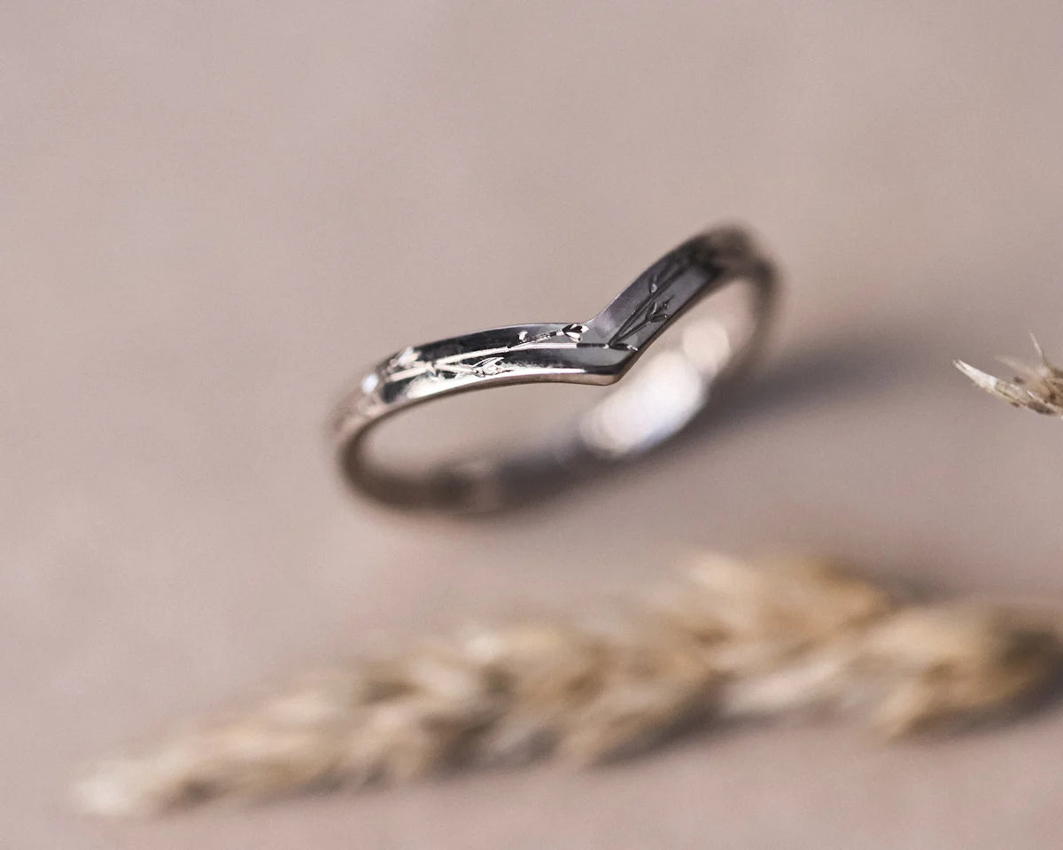 Side view of handmade pressed flower wishbone ring in white gold