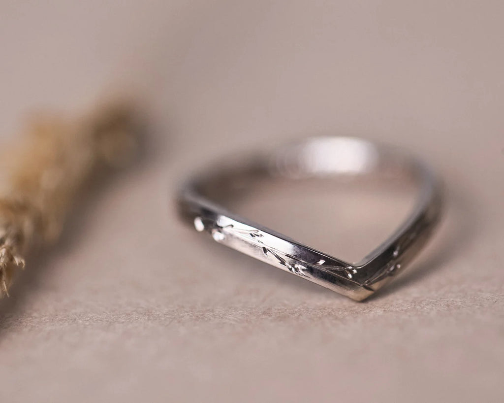  Detailed view of 18ct white gold wishbone ring with hand engraving