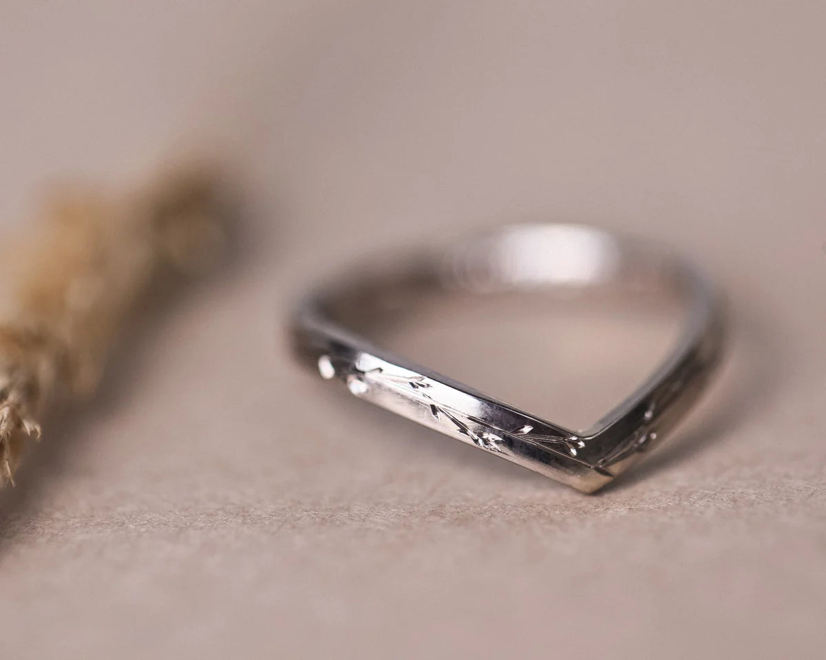  Detailed view of 18ct white gold wishbone ring with hand engraving