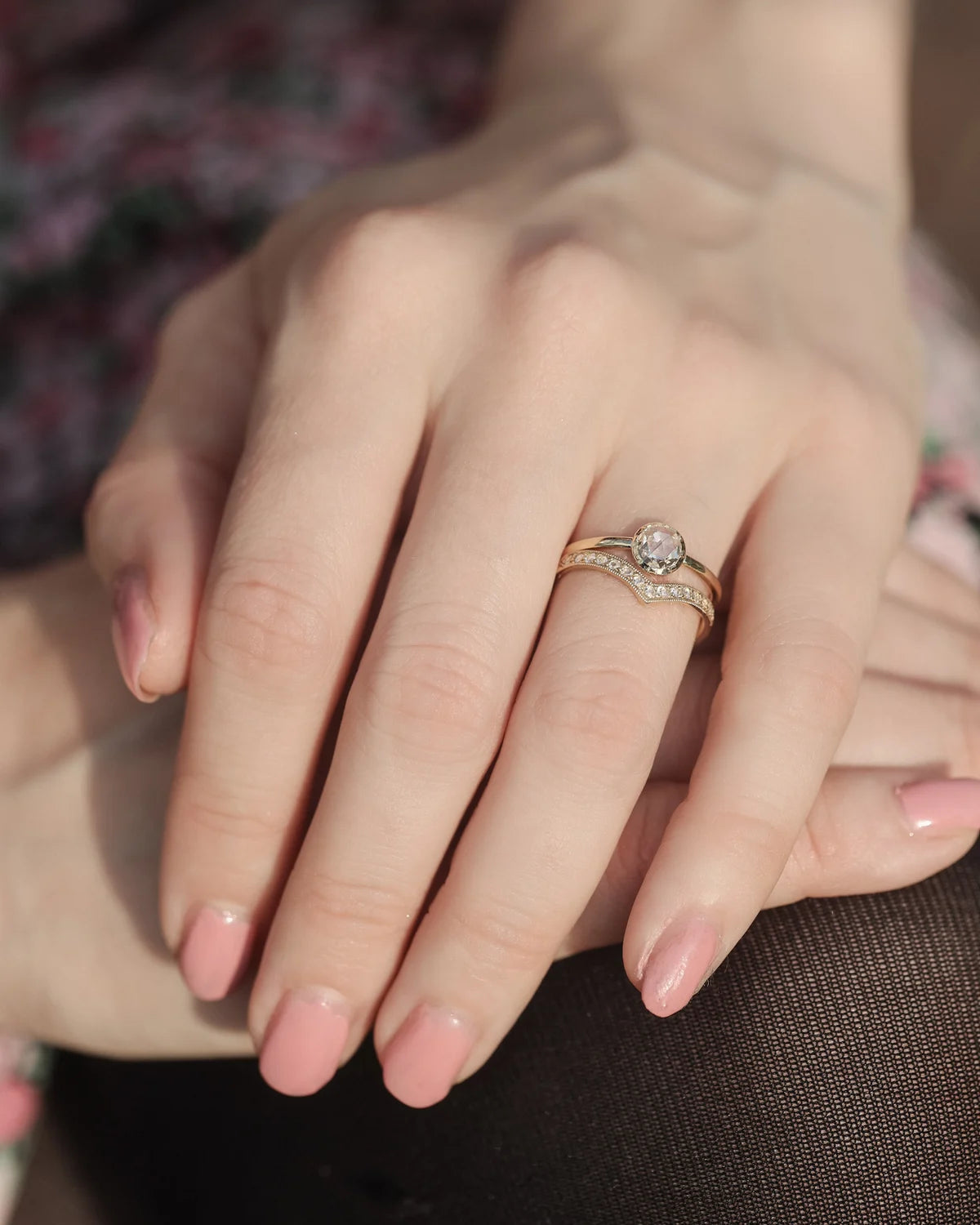 Rose-cut diamond solitaire ring worn on hand in natural light
