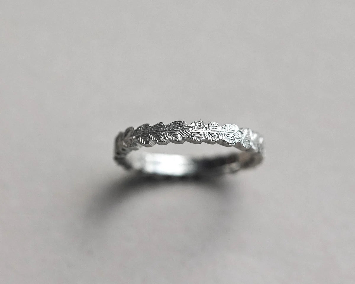 hand carved oak leaf detail platinum ring surface
