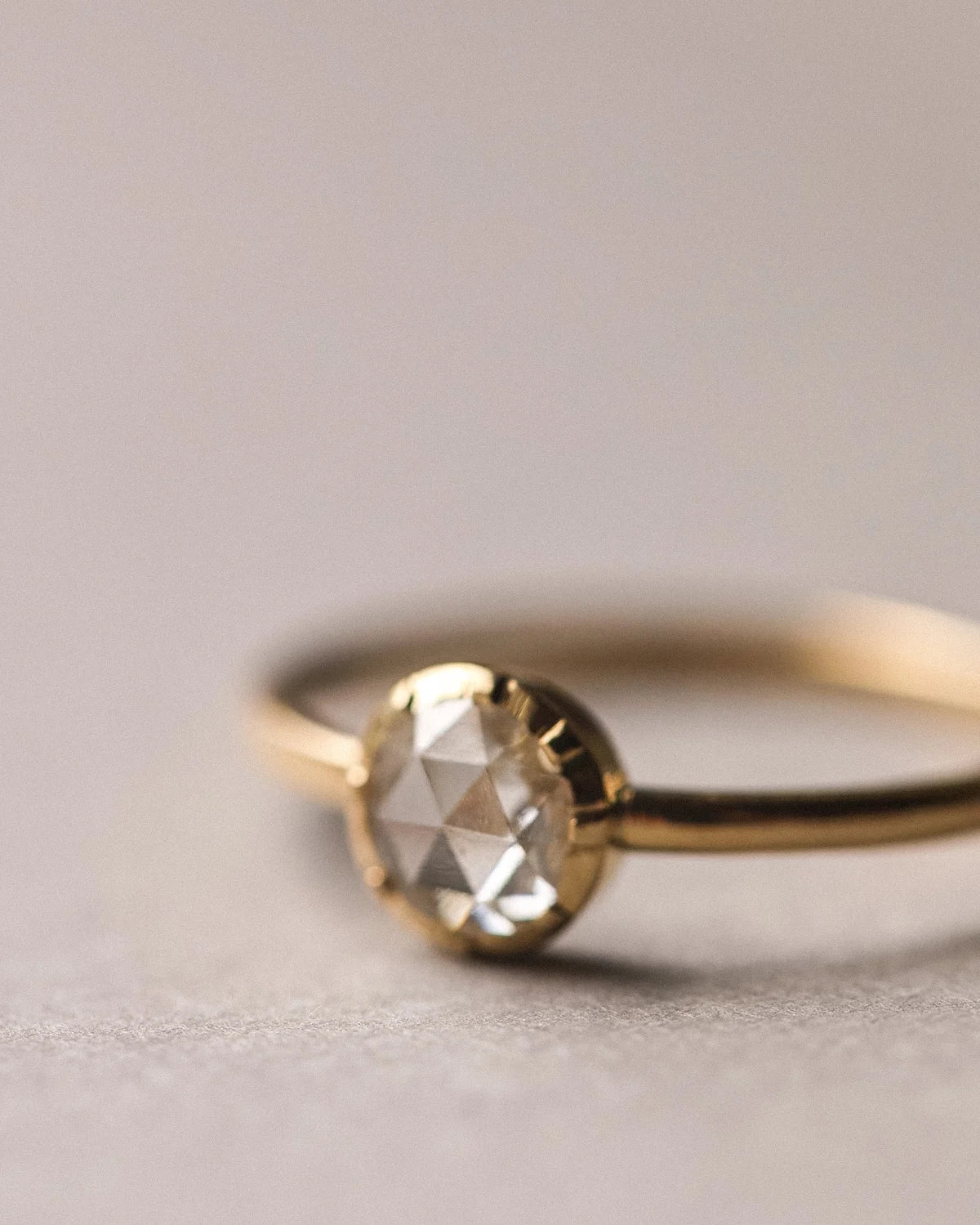 Close-up of 5mm rose-cut diamond in traditional cut-down setting