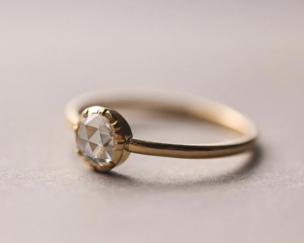 Side view of 18ct yellow gold rose-cut diamond solitaire ring