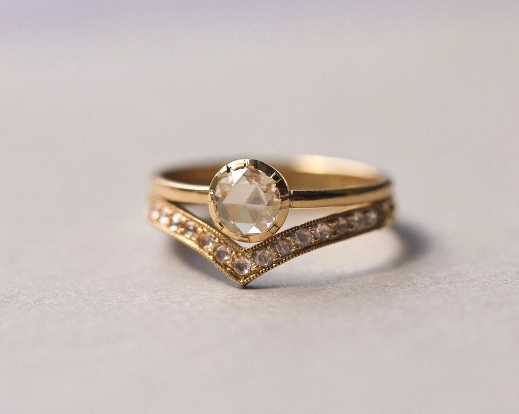 18ct yellow gold rose-cut diamond ring stacked with curved diamond band