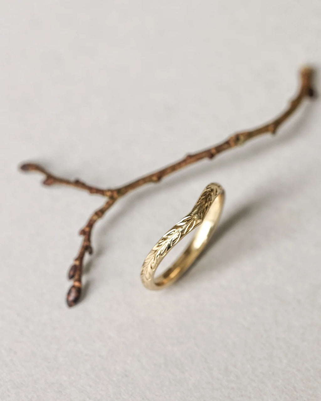 fine gold wishbone wedding ring olive leaf detail
