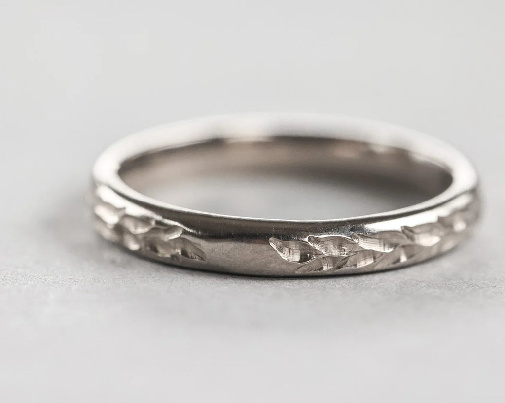 Front view of 3mm white gold wedding band with Barleycorn engraving