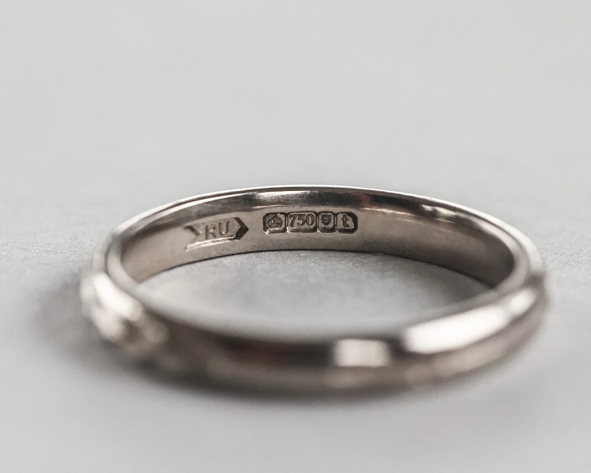 Inside view of 18ct white gold wedding ring with hallmark