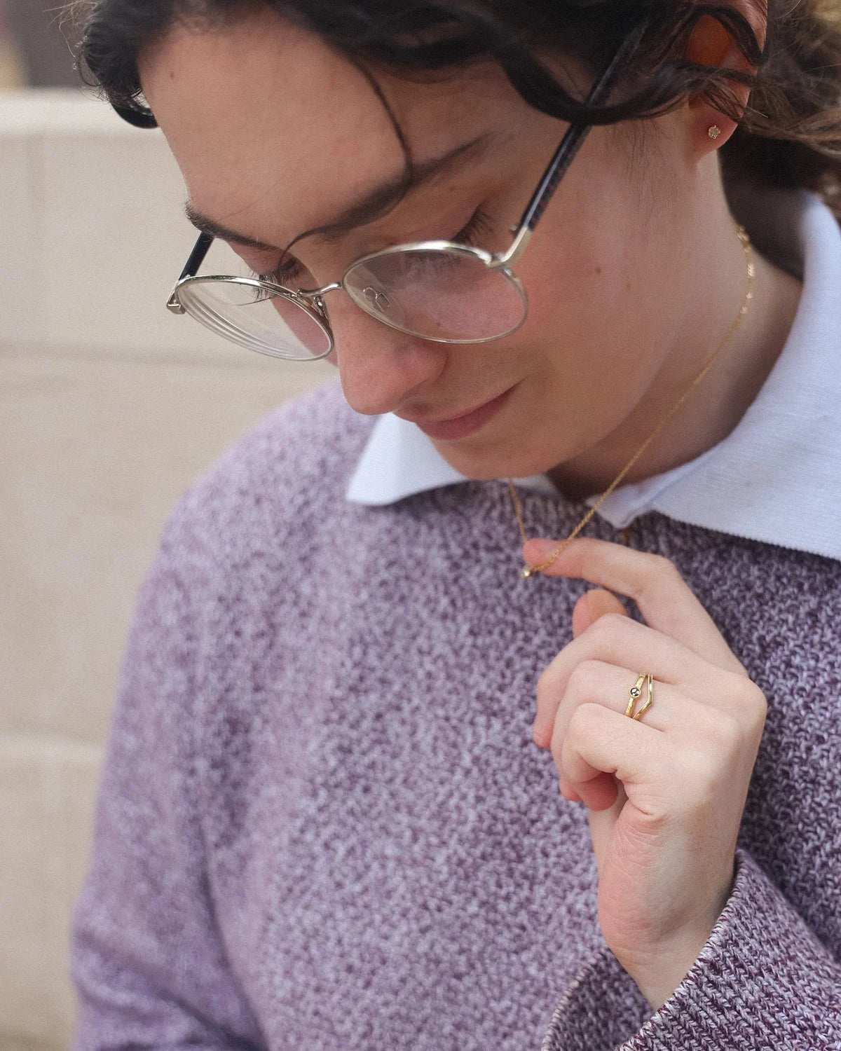 Champagne rose-cut diamond ring worn with purple knit and shirt styling