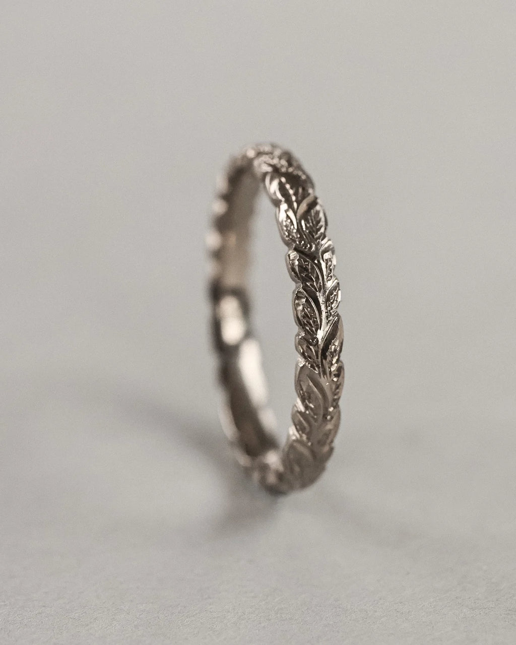 close up laurel leaf carving on 3mm white gold ring