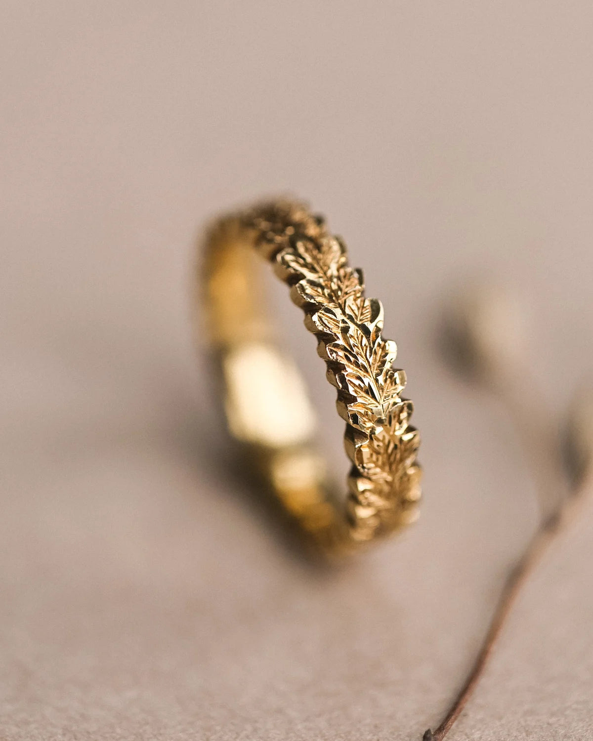 textured gold wedding band carved oak leaf surface detail