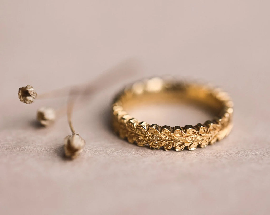 hand carved oak leaf detail gold ring textured surface