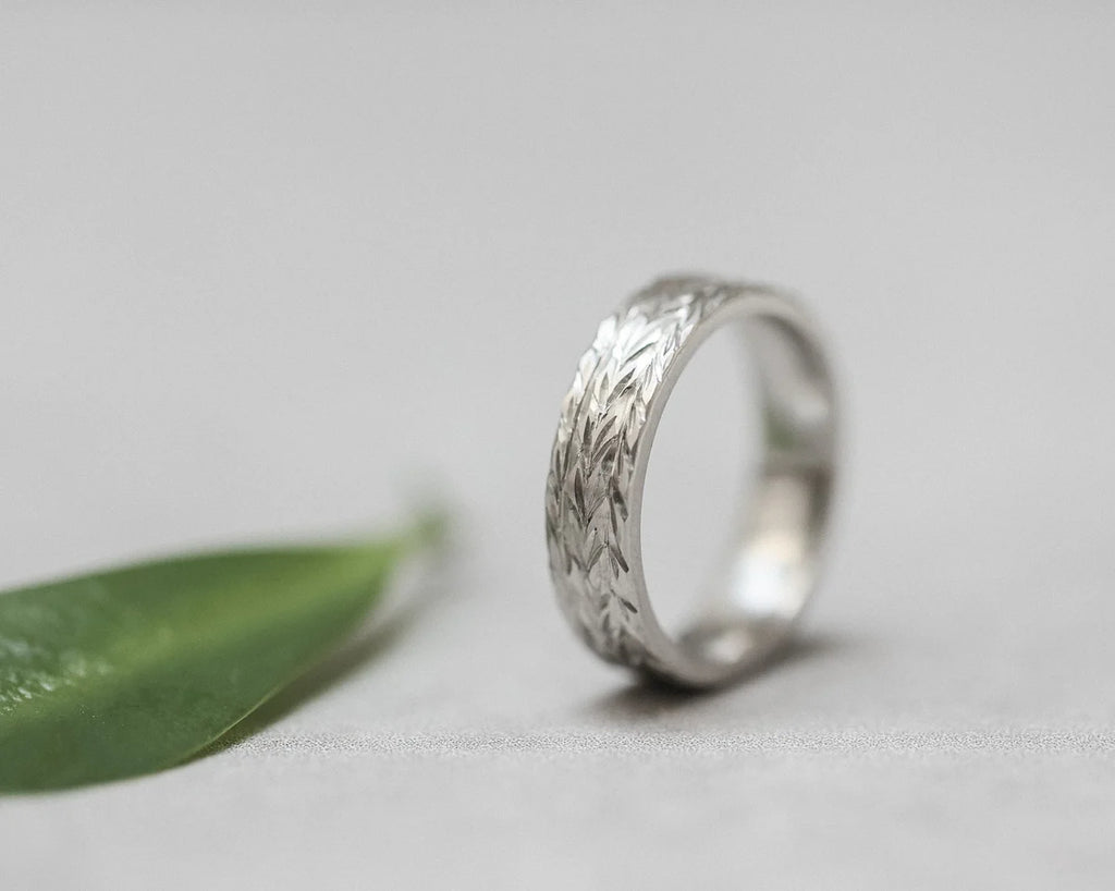 linear engraved pattern detail platinum ring herringbone design