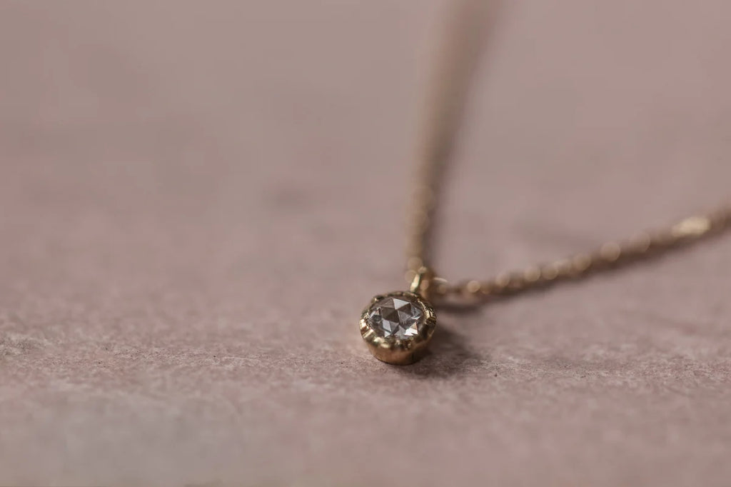 close up rose cut white diamond pendant