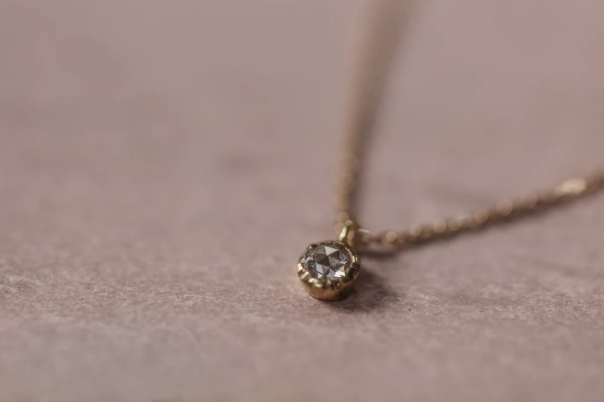 close up rose cut white diamond pendant
