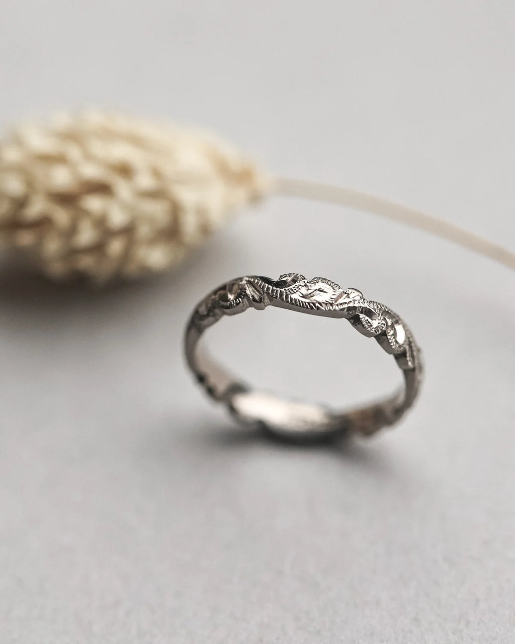 organic floral pattern engraved on 18ct white gold wedding band