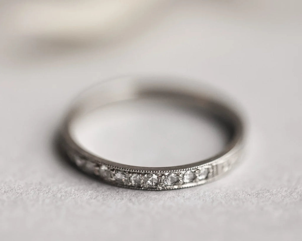 pave rose cut diamonds detail eternity ring platinum milled edge