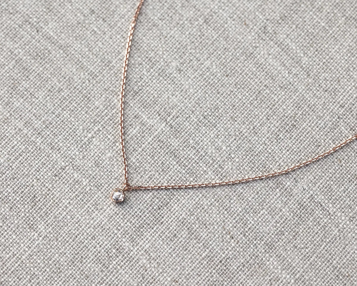 rose gold chain and diamond pendant