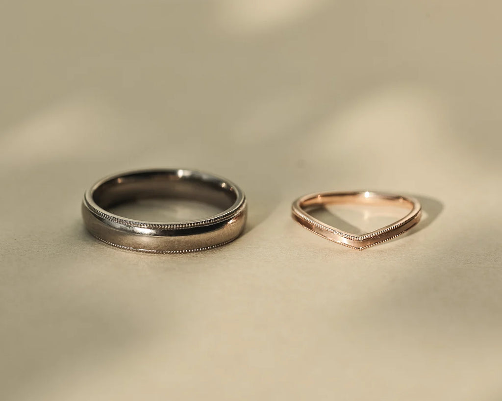 18ct rose gold wishbone ring paired with platinum wedding band