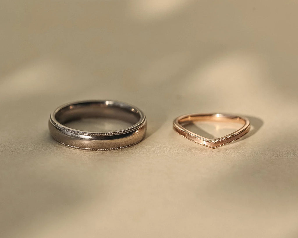 18ct white gold court ring paired with polished rose gold wedding band