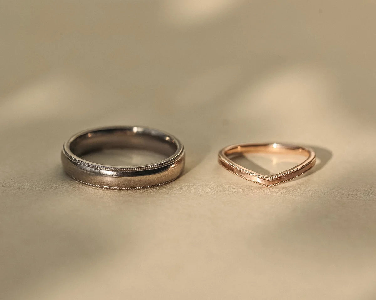 18ct white gold court ring paired with polished rose gold wedding band