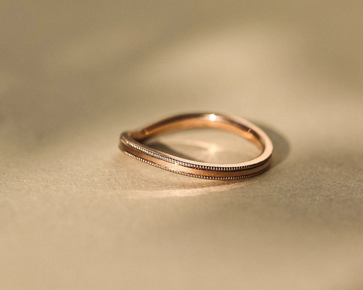Minimal 18ct rose gold wishbone wedding band with fine milled edge