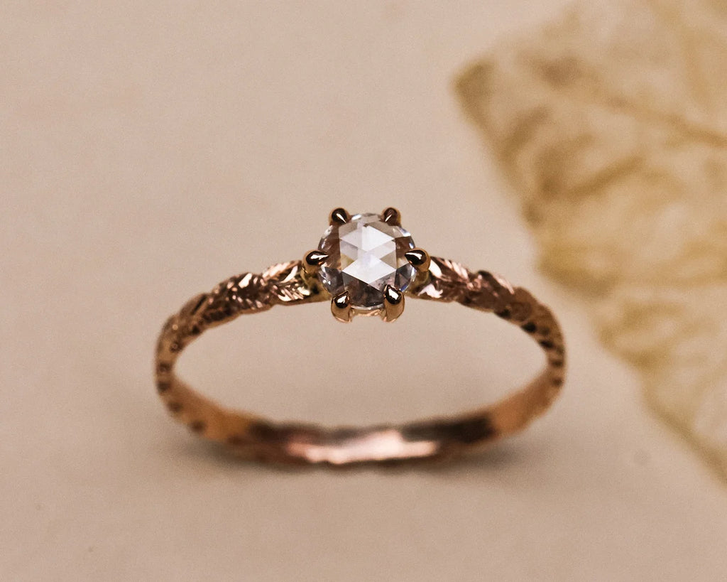Hand carved laurel leaf detail on rose gold ring