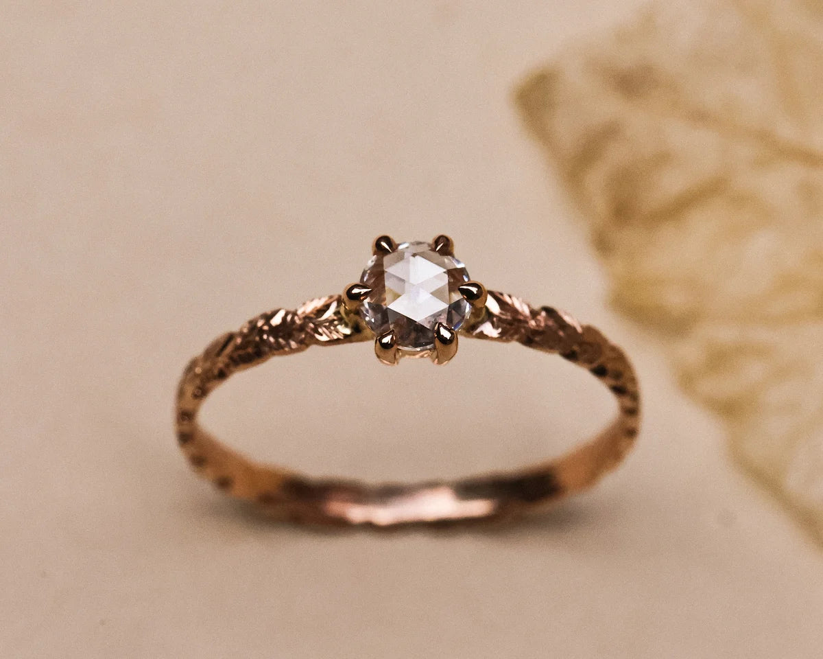 Hand carved laurel leaf detail on rose gold ring
