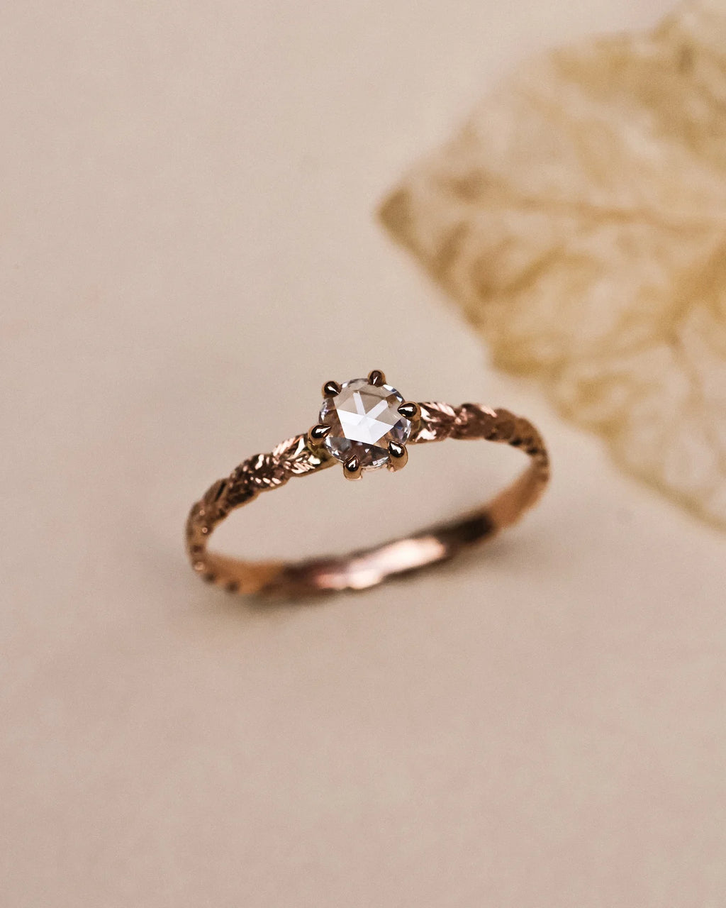 Side view of rose-cut diamond laurel leaf ring