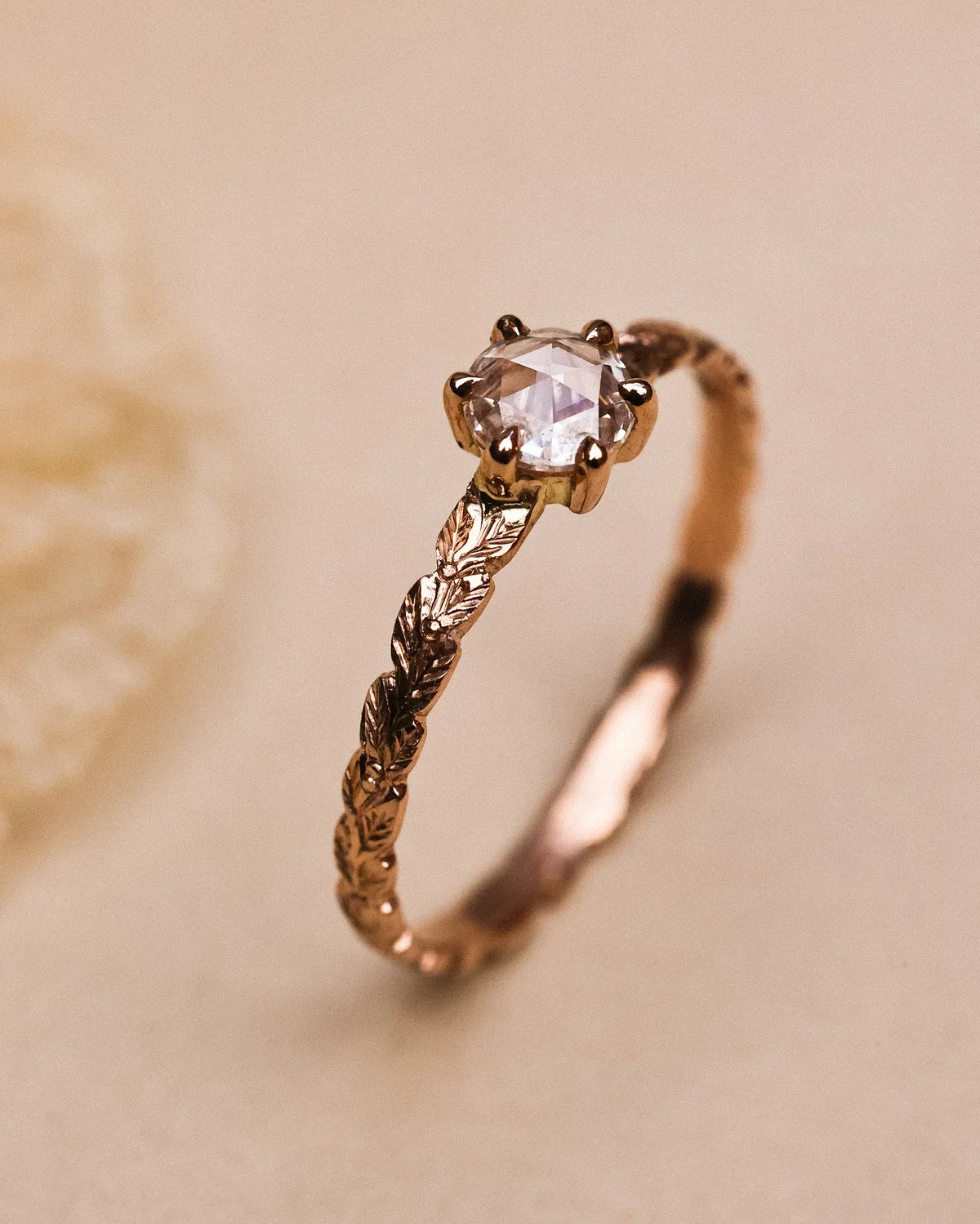 White rose-cut diamond set in 18ct rose gold