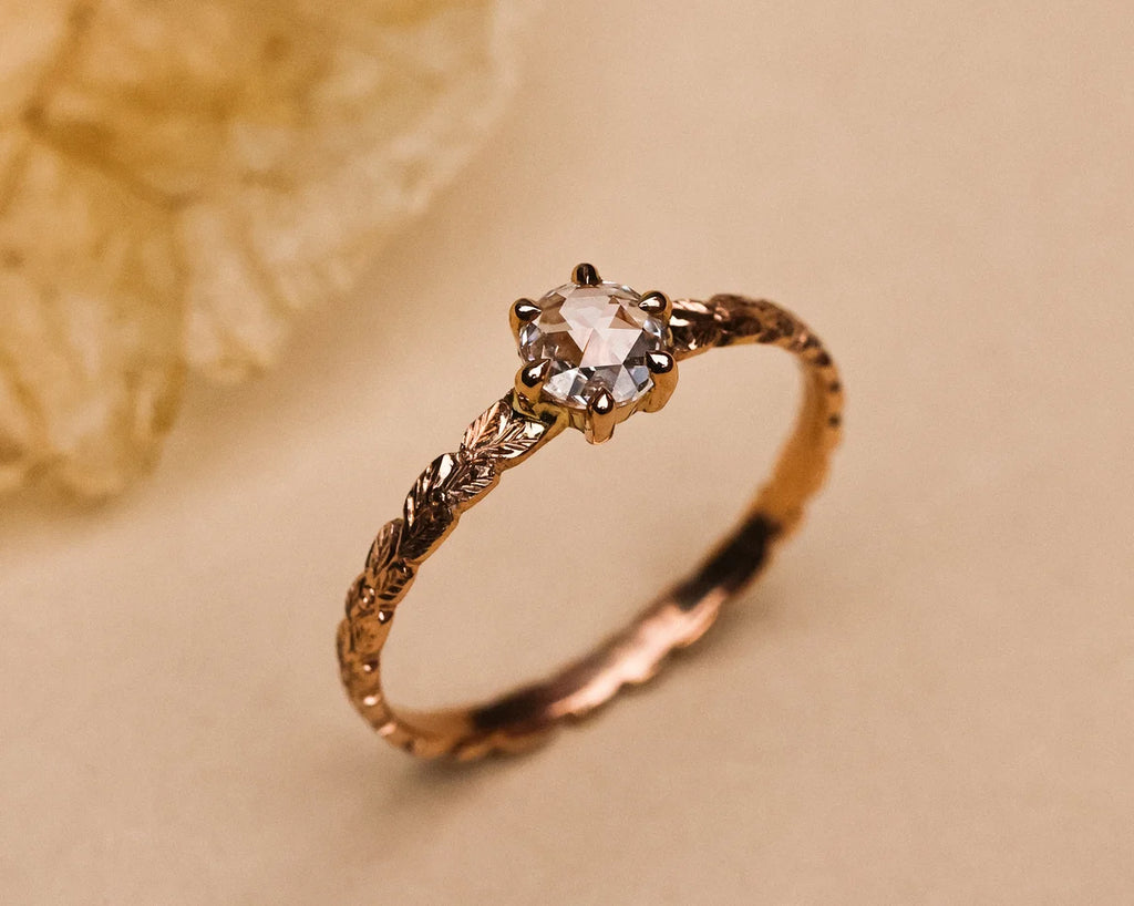 Detailed view of hand carved rose gold band