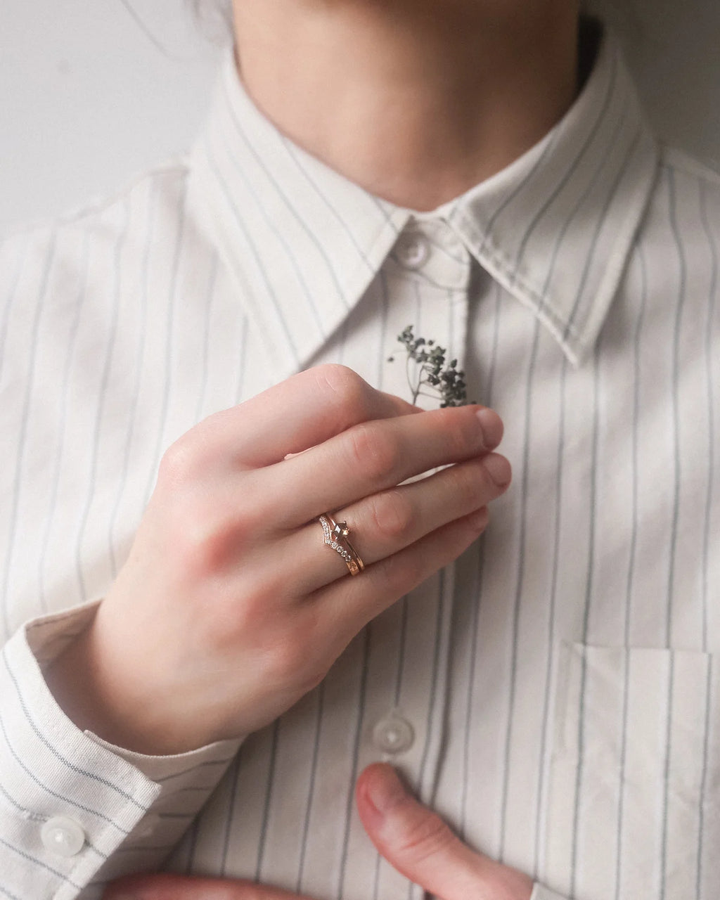 wishbone diamond ring worn with engagement ring 18ct rose gold