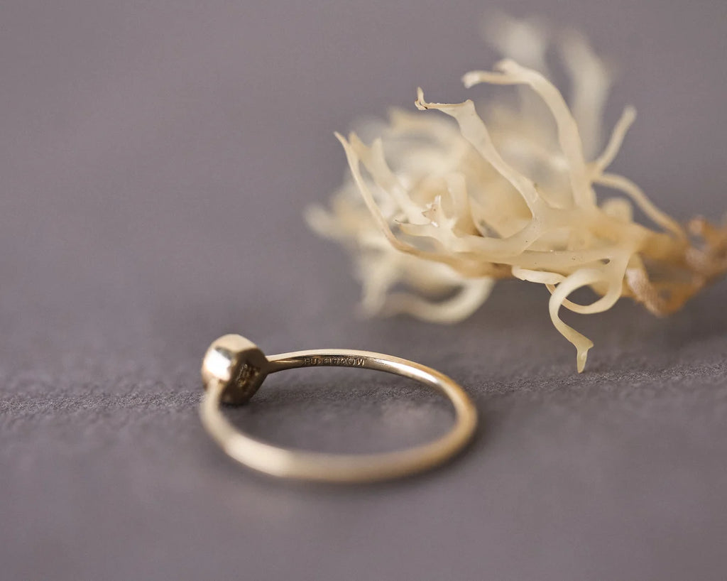 Side view of 18ct yellow gold ring with yellow-grey rose-cut diamond