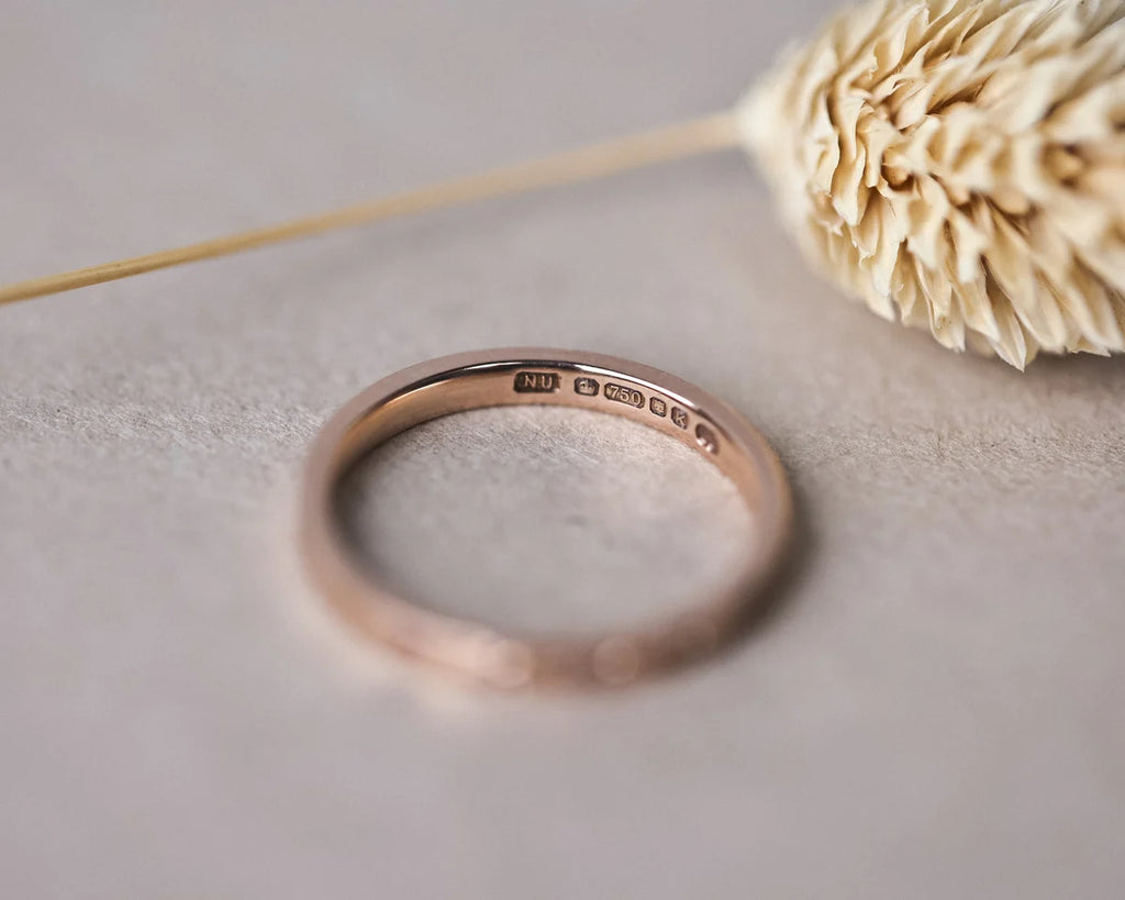 Inside view of 18ct rose gold flat court ring with hallmark