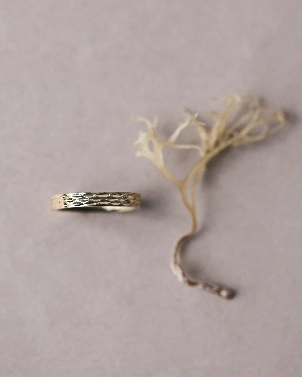 gold band side view subtle textured engraving