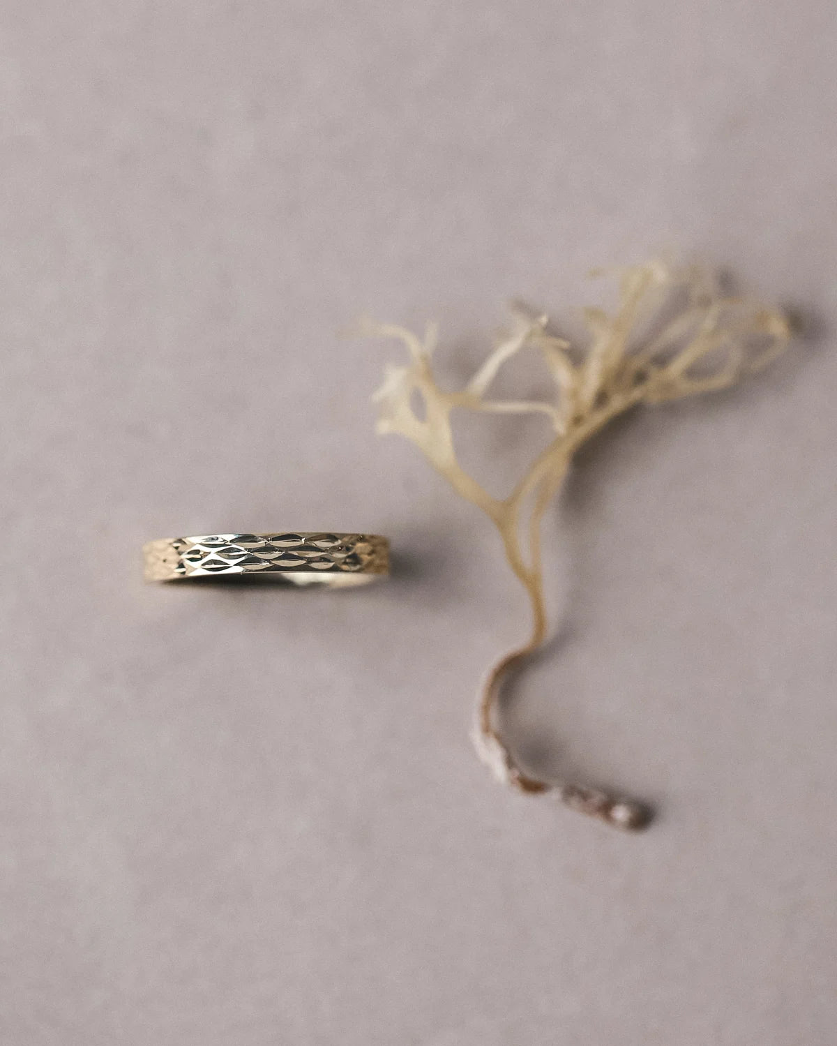 gold band side view subtle textured engraving