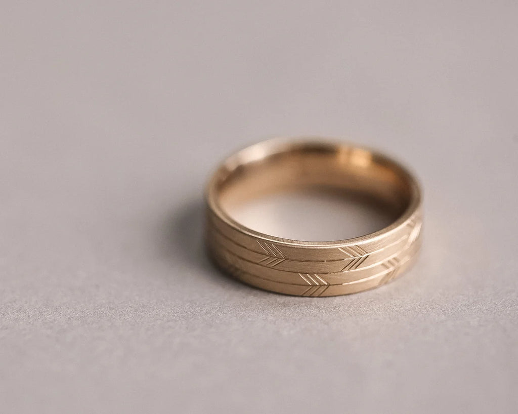 bold arrow engraving detail 6mm gold wedding band