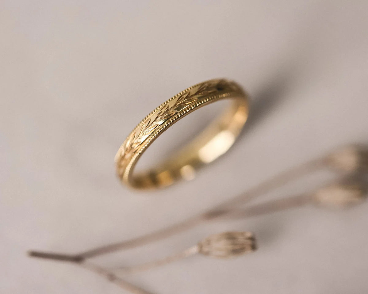 engraved olive pattern detail gold band ring