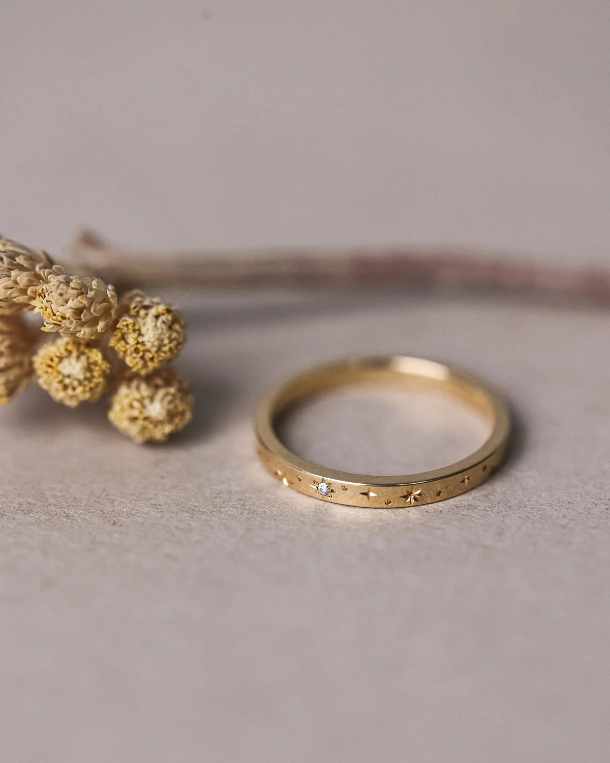 Inside view of 18ct yellow gold eternity ring with star engraving