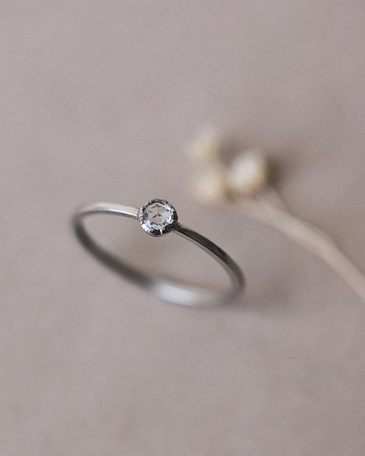 Angled view of handmade platinum rose-cut diamond ring