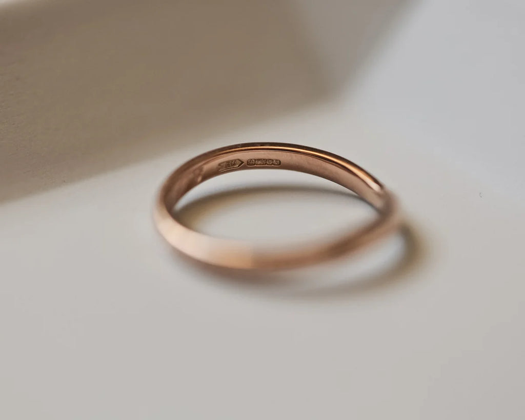 Back view of 18ct rose gold wishbone ring with smooth interior