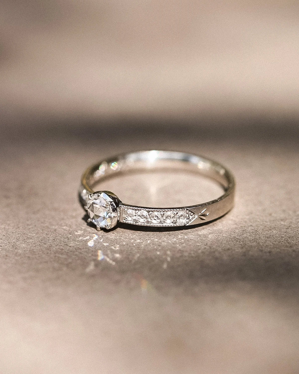 Ethical handmade platinum engagement ring with pavé diamonds