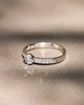 Ethical handmade platinum engagement ring with pavé diamonds
