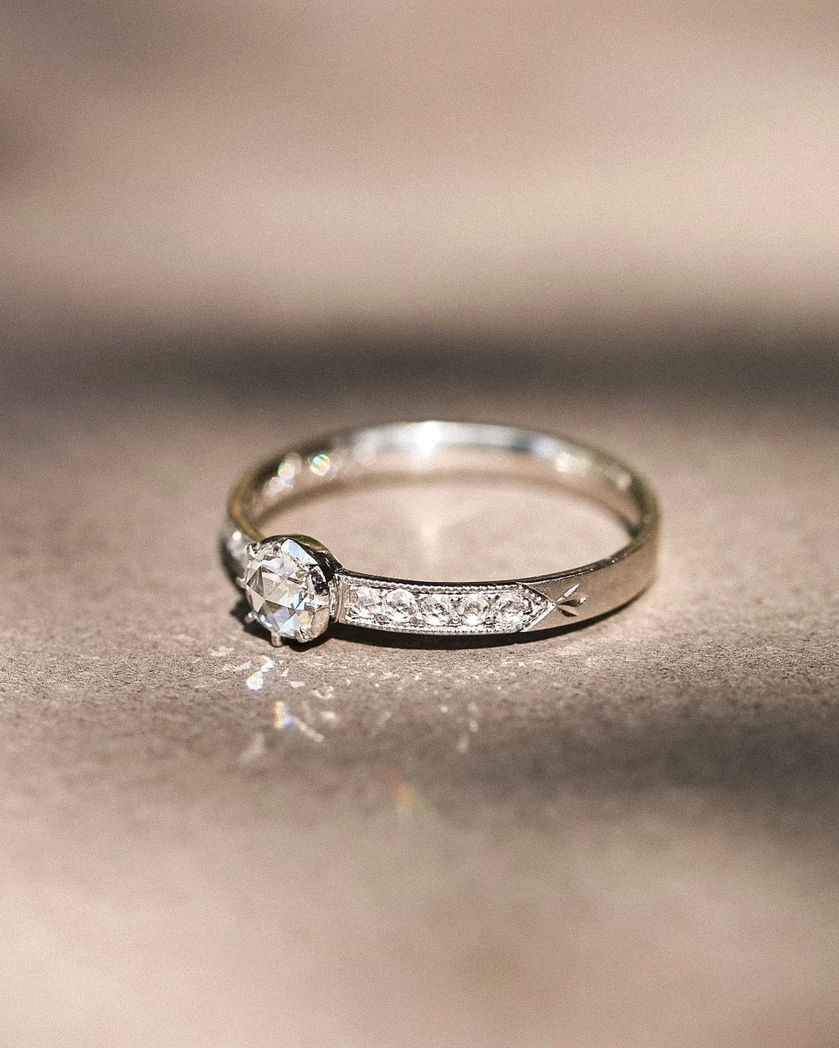 Ethical handmade platinum engagement ring with pavé diamonds