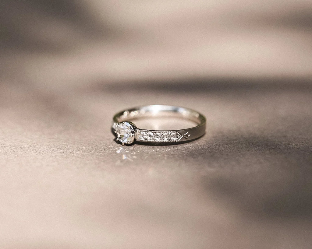 Fine platinum ring with rose-cut diamond and milgrain detail
